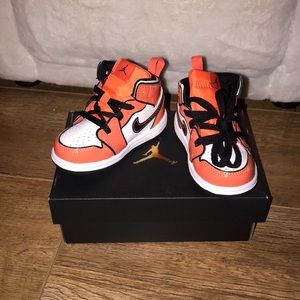 Orange, black and white toddler Jordan’s. Brand new. Size 5c.